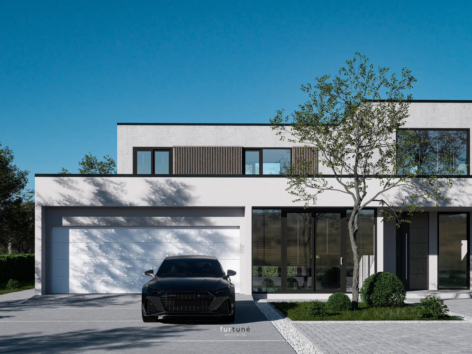 Ansicht der Vorfahrt mit Baum und Fassade